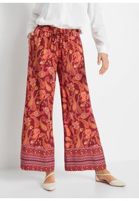 bonprix - Spodnie z szerokimi nogawkami. Kolor: czerwony. Wzór: paisley, nadruk