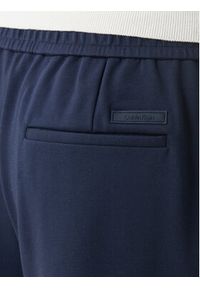 Calvin Klein Spodnie materiałowe LV04LF607G Granatowy Tapered Fit. Kolor: niebieski. Materiał: wiskoza #4