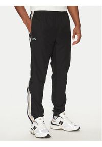 Lacoste Spodnie dresowe XH8974 Czarny Relaxed Fit. Kolor: czarny. Materiał: syntetyk
