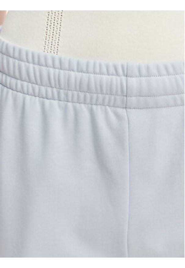 Lacoste Spodnie dresowe XF7604 Niebieski jasny Regular Fit. Kolor: niebieski. Materiał: bawełna