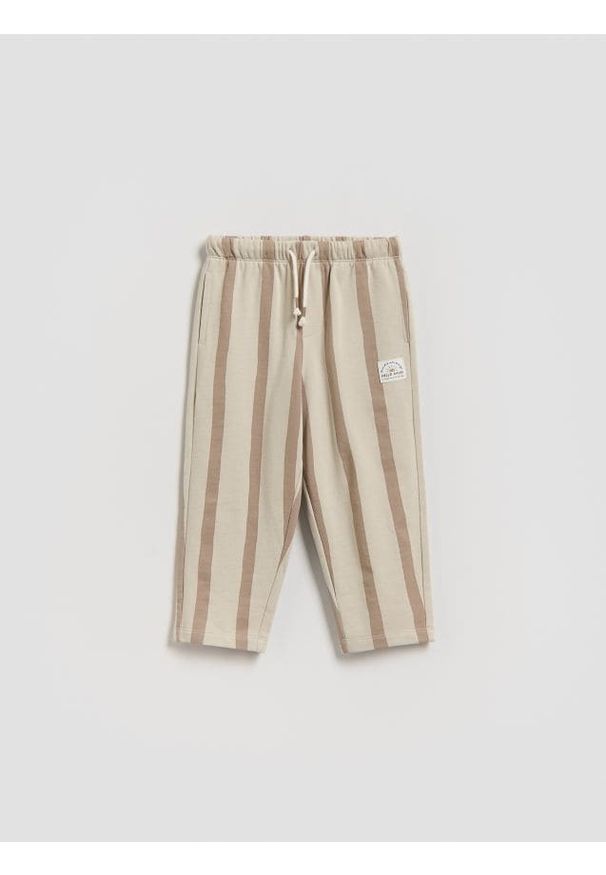 Reserved - Dresowe spodnie oversize - brązowy. Kolor: brązowy. Materiał: dresówka