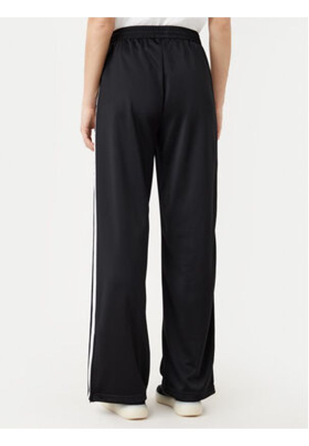 Adidas - adidas Spodnie dresowe adicolor Classic Firebird JC8245 Czarny Loose Fit. Kolor: czarny. Materiał: syntetyk