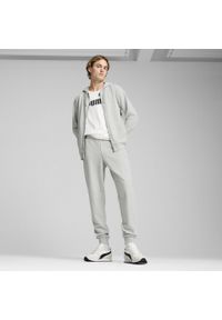 Puma - Męskie dres z kapturem PUMA Light Gray Heather. Kolor: czarny, szary, wielokolorowy. Materiał: dresówka. Wzór: haft, aplikacja