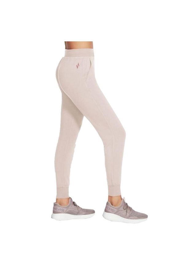 skechers - Spodnie treningowe damskie Skechers Restful Jogger. Kolor: różowy. Materiał: dresówka