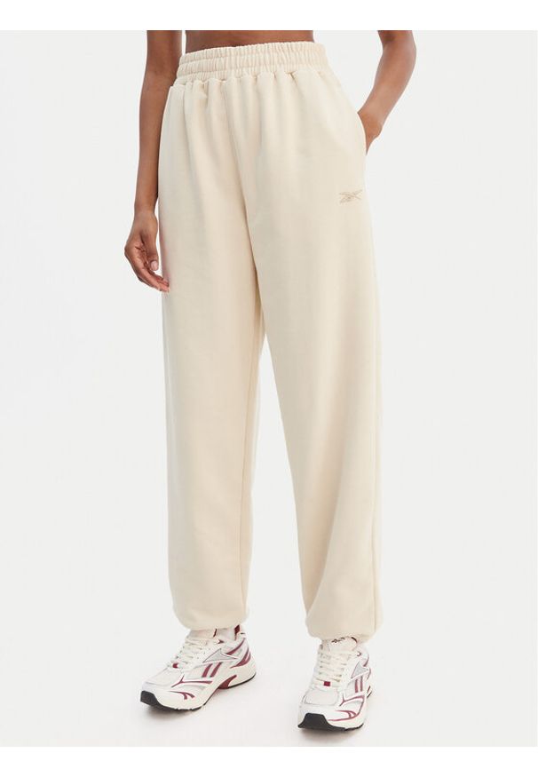 Reebok Spodnie dresowe Reebok x Ewa Chodakowska Ada RK25621CCW Beżowy Relaxed Fit. Kolor: beżowy. Materiał: syntetyk