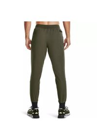 Spodnie dresowe męskie Under Armour UNSTOPPABLE JOGGERS. Kolor: zielony. Materiał: dresówka