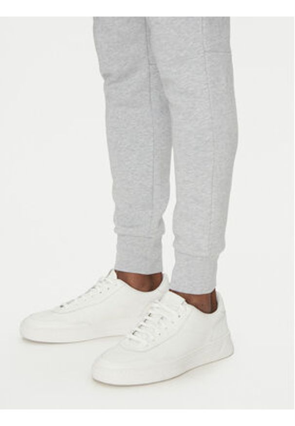 Lacoste Spodnie dresowe XH9624 Szary Regular Fit. Kolor: szary. Materiał: bawełna
