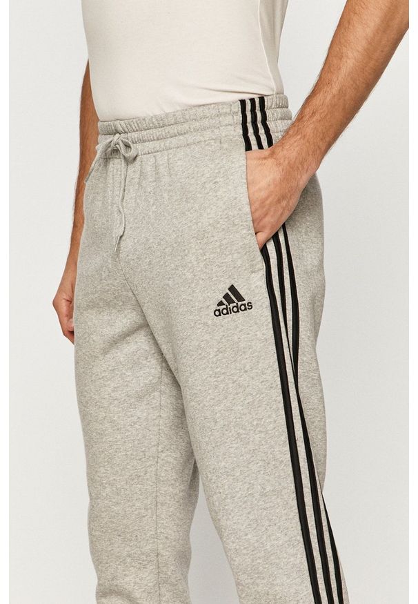 Adidas - adidas - Spodnie. Kolor: szary. Materiał: dzianina