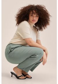 mango - Mango spodnie Fluido damskie kolor brązowy szerokie high waist. Stan: podwyższony. Kolor: brązowy. Materiał: włókno #4