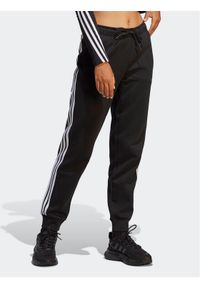 Adidas - adidas Spodnie dresowe Future Icons 3-Stripes Regular Tracksuit Bottoms HT4704 Czarny Regular Fit. Kolor: czarny. Materiał: bawełna