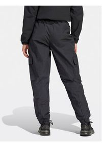 Adidas - adidas Spodnie dresowe City Escape IQ4826 Czarny Loose Fit. Kolor: czarny. Materiał: syntetyk #4