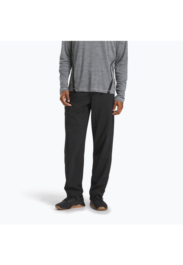 Reebok Fitness - Spodnie treningowe męskie Reebok Id Train Woven Unlined. Kolor: czarny. Sport: fitness