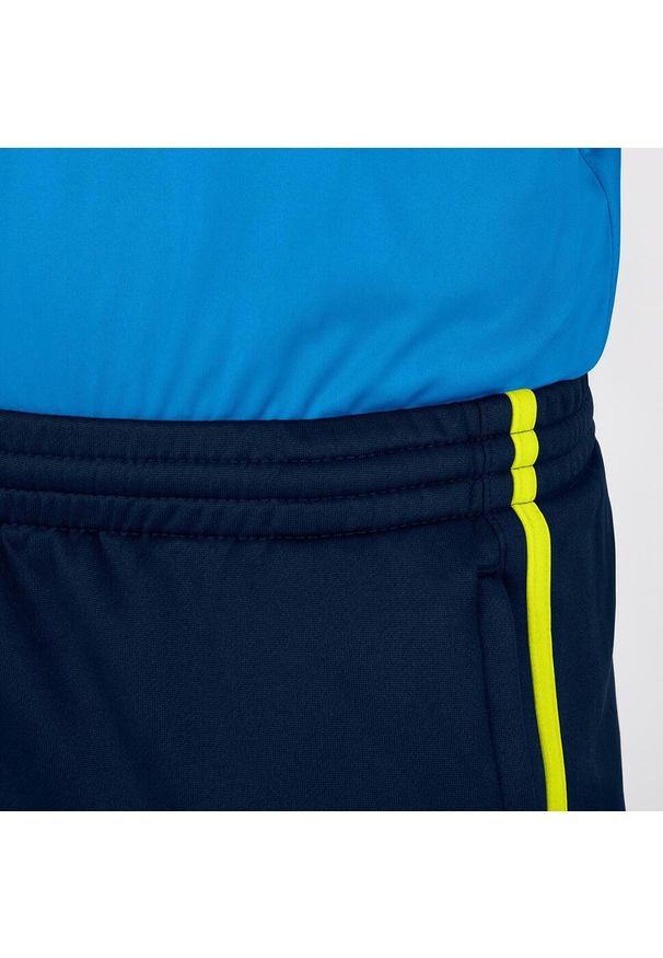 Spodnie dziecięce Jako d'entraînement Active. Kolor: wielokolorowy, niebieski, żółty. Sport: piłka nożna