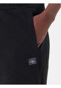 Calvin Klein Jeans Spodnie dresowe LV047C249G Czarny Regular Fit. Kolor: czarny. Materiał: bawełna #5