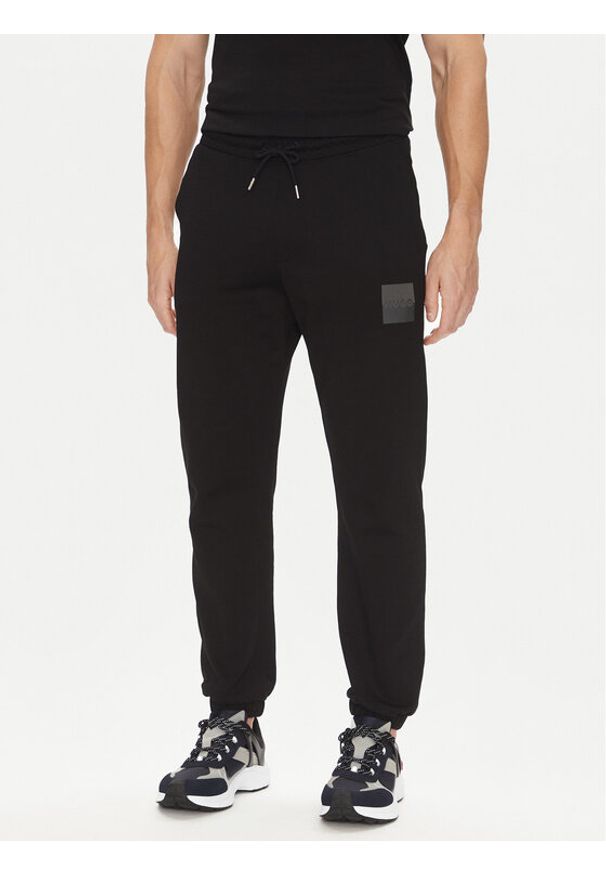 Hugo - HUGO Spodnie dresowe Dusplitan 50542866 Czarny Relaxed Fit. Kolor: czarny. Materiał: bawełna