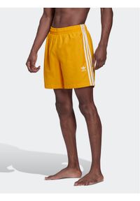 Adidas - adidas Szorty kąpielowe adicolor Classics 3-Stripes HK7327 Żółty Regular Fit. Kolor: żółty. Materiał: syntetyk