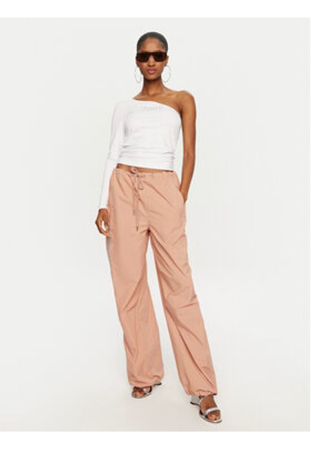 Juicy Couture Spodnie dresowe Ayla JCWBJ24306 Beżowy Loose Fit. Kolor: beżowy. Materiał: syntetyk