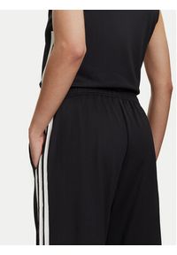 Adidas - adidas Spodnie dresowe Tiro Cut 3-Stripes Mesh JG4103 Czarny Loose Fit. Kolor: czarny. Materiał: syntetyk #4