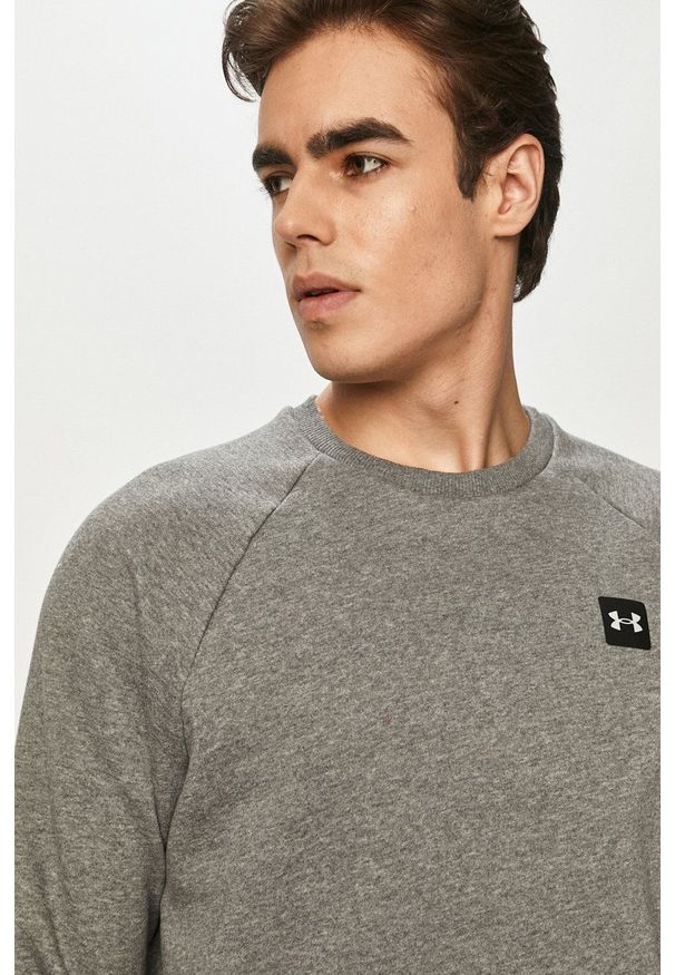 Under Armour bluza 1357096 męska kolor szary gładka. Okazja: na co dzień. Kolor: szary. Materiał: dzianina. Długość rękawa: raglanowy rękaw. Wzór: gładki. Styl: casual