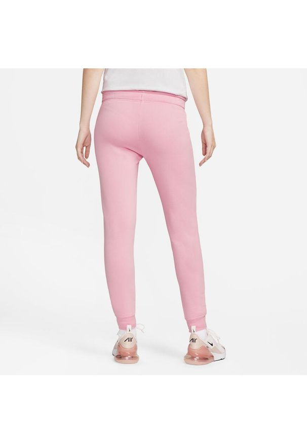 Nike - Spodnie Mid-Rise Slim Rozmiar M Różowy - DQ5174-690. Kolor: różowy. Materiał: materiał. Sport: fitness