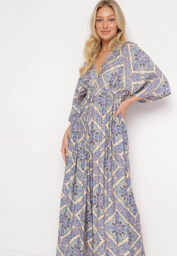 Born2be - Niebieski Kombinezon Boho z Gumką w Talii Wiązany na Plecach z Szerokimi Nogawkami Rodolia. Okazja: na co dzień. Kolor: niebieski. Długość rękawa: krótki rękaw. Długość: krótkie. Styl: boho