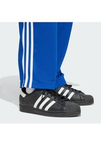 Adidas - adidas Spodnie dresowe adicolor Firebird KD4079 Niebieski Regular Fit. Kolor: niebieski. Materiał: syntetyk #2