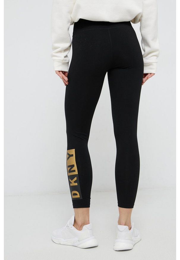 DKNY - Dkny Legginsy damskie kolor złoty z nadrukiem. Kolor: złoty. Materiał: dzianina. Wzór: nadruk