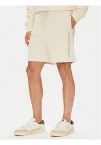Tommy Jeans Szorty sportowe New Classic Beach DM0DM21781 Beżowy Relaxed Fit. Kolor: beżowy. Materiał: bawełna. Styl: sportowy