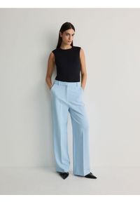 Reserved - Spodnie z kantem - jasnoniebieski. Kolor: niebieski. Materiał: tkanina, wiskoza #1