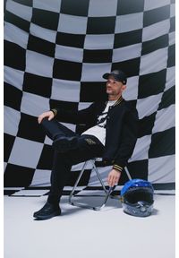 4f - 4F Spodnie dresowe joggery uniseks 4F x Bartosz Zmarzlik - czarne XS. Kolor: czarny. Materiał: dresówka. Wzór: nadruk #1