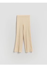 Reserved - Dzianinowe spodnie flare - złamana biel. Materiał: dzianina