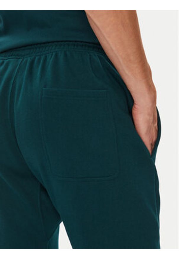 Adidas - adidas Spodnie dresowe ALL SZN Fleece JX5096 Zielony Tapered Leg. Kolor: zielony. Materiał: bawełna