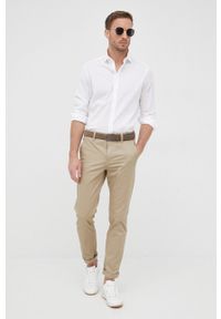G-Star RAW - G-Star Raw spodnie męskie kolor beżowy w fasonie chinos. Kolor: beżowy. Materiał: tkanina. Wzór: gładki