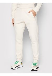 Adidas - adidas Spodnie dresowe adicolor Essentials HE9410 Beżowy Slim Fit. Kolor: beżowy. Materiał: dresówka, bawełna #1