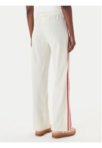 Adidas - adidas Spodnie dresowe Firebird KQ8056 Beżowy Loose Fit. Kolor: beżowy. Materiał: syntetyk #2