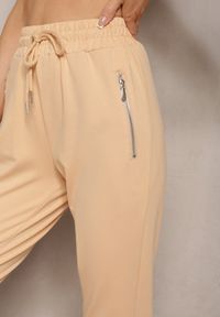 Renee - Jasnożółte Dresowe Spodnie Bawełniane Joggery z Kieszeniami na Suwaki Bieitta. Kolor: żółty. Materiał: bawełna, dresówka