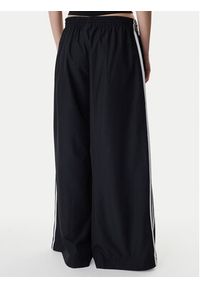 Adidas - adidas Spodnie dresowe Firebird Adilenium KD2914 Czarny Regular Fit. Kolor: czarny. Materiał: syntetyk #4