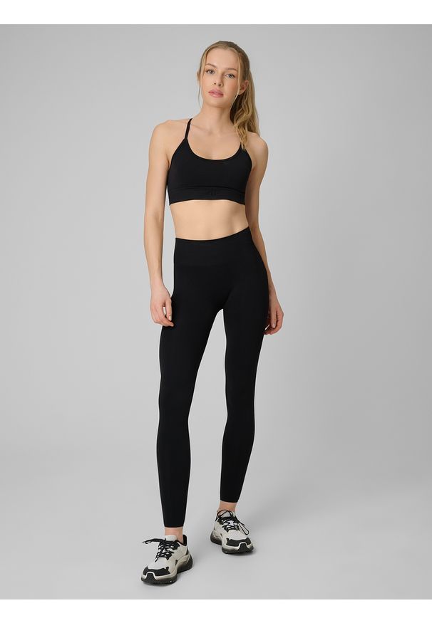 4f - 4F Legginsy treningowe bezszwowe damskie - czarne M/L. Stan: podwyższony. Kolor: czarny. Materiał: skóra. Długość: długie. Sport: fitness
