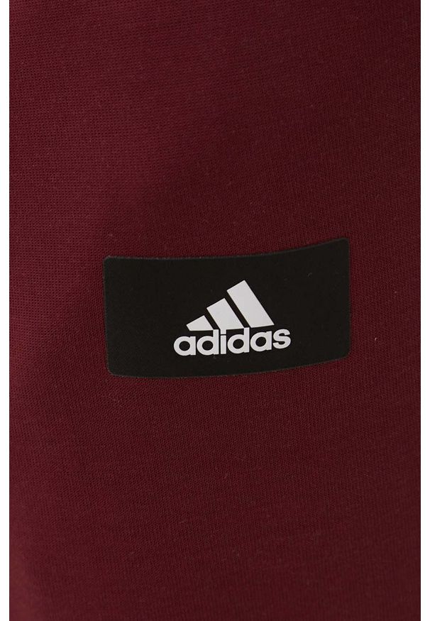 adidas Performance spodnie HC5262 męskie kolor bordowy z aplikacją. Kolor: czerwony. Materiał: bawełna. Wzór: aplikacja