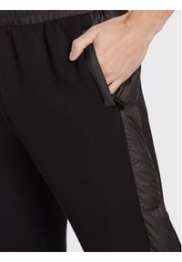 John Richmond Spodnie dresowe UMA22012PA Czarny Regular Fit. Kolor: czarny. Materiał: wiskoza