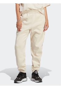Adidas - adidas Spodnie dresowe Essentials Fleece IA6436 Écru Regular Fit. Materiał: bawełna #1