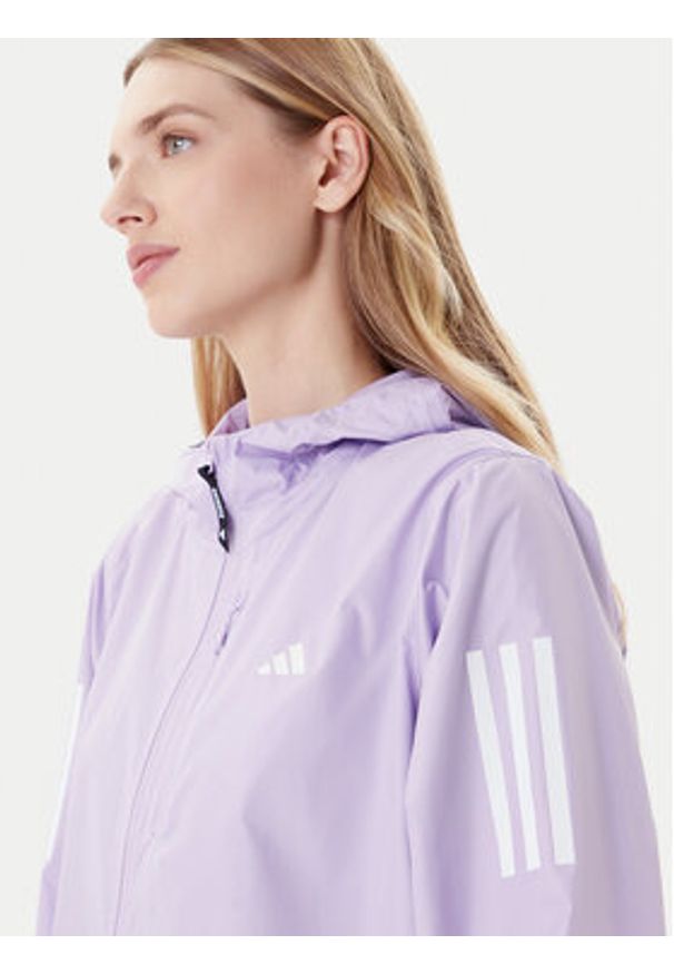 Adidas - adidas Kurtka do biegania Own The Run JX2264 Fioletowy Regular Fit. Kolor: fioletowy. Materiał: syntetyk. Sport: bieganie