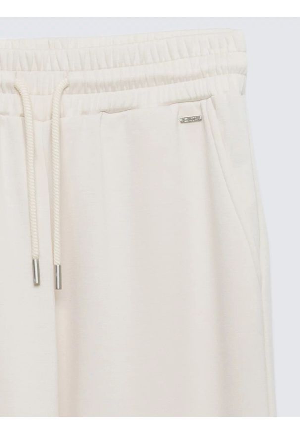 Big-Star - Spodnie damskie dresowe z szeroką nogawką kremowe Lunarap 102. Kolor: kremowy. Materiał: dresówka. Styl: elegancki
