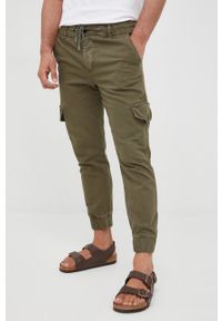 Desigual spodnie męskie kolor zielony joggery. Kolor: zielony. Materiał: tkanina