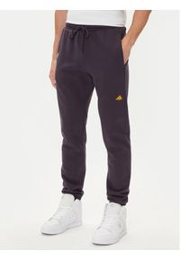 Adidas - adidas Spodnie dresowe Fortnite JV8015 Fioletowy Regular Fit. Kolor: fioletowy. Materiał: bawełna