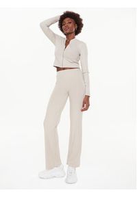 Calvin Klein Jeans Spodnie materiałowe J20J220678 Beżowy Flare Fit. Kolor: beżowy. Materiał: materiał, wiskoza