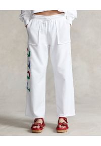 Ralph Lauren - RALPH LAUREN - Bawełniane białe dresowe spodnie z szerokimi nogawkami. Kolor: biały. Materiał: dresówka, bawełna. Długość: długie. Wzór: haft, napisy, kolorowy