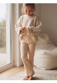 Sinsay - Prążkowane spodnie flare - kremowy. Kolor: kremowy. Materiał: prążkowany #1