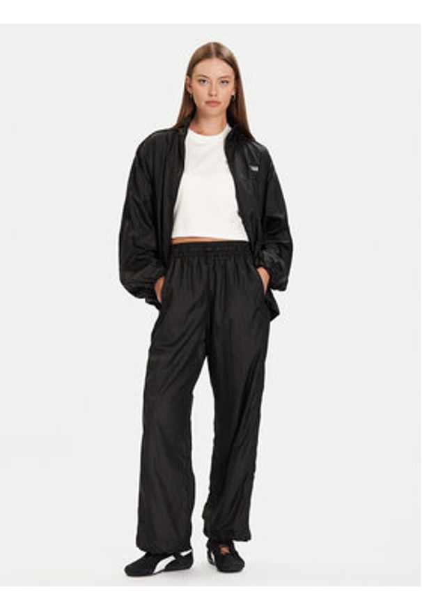 Puma Spodnie dresowe PUMA X ROSÉ T7 633796 01 Czarny Relaxed Fit. Kolor: czarny. Materiał: syntetyk