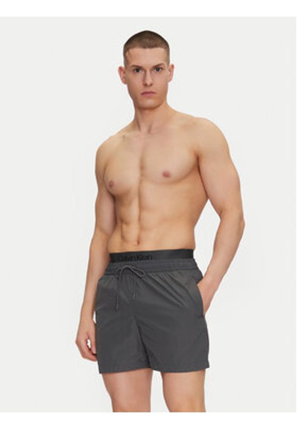 Calvin Klein Swimwear Szorty kąpielowe KM0KM01104 Szary Regular Fit. Kolor: szary. Materiał: syntetyk